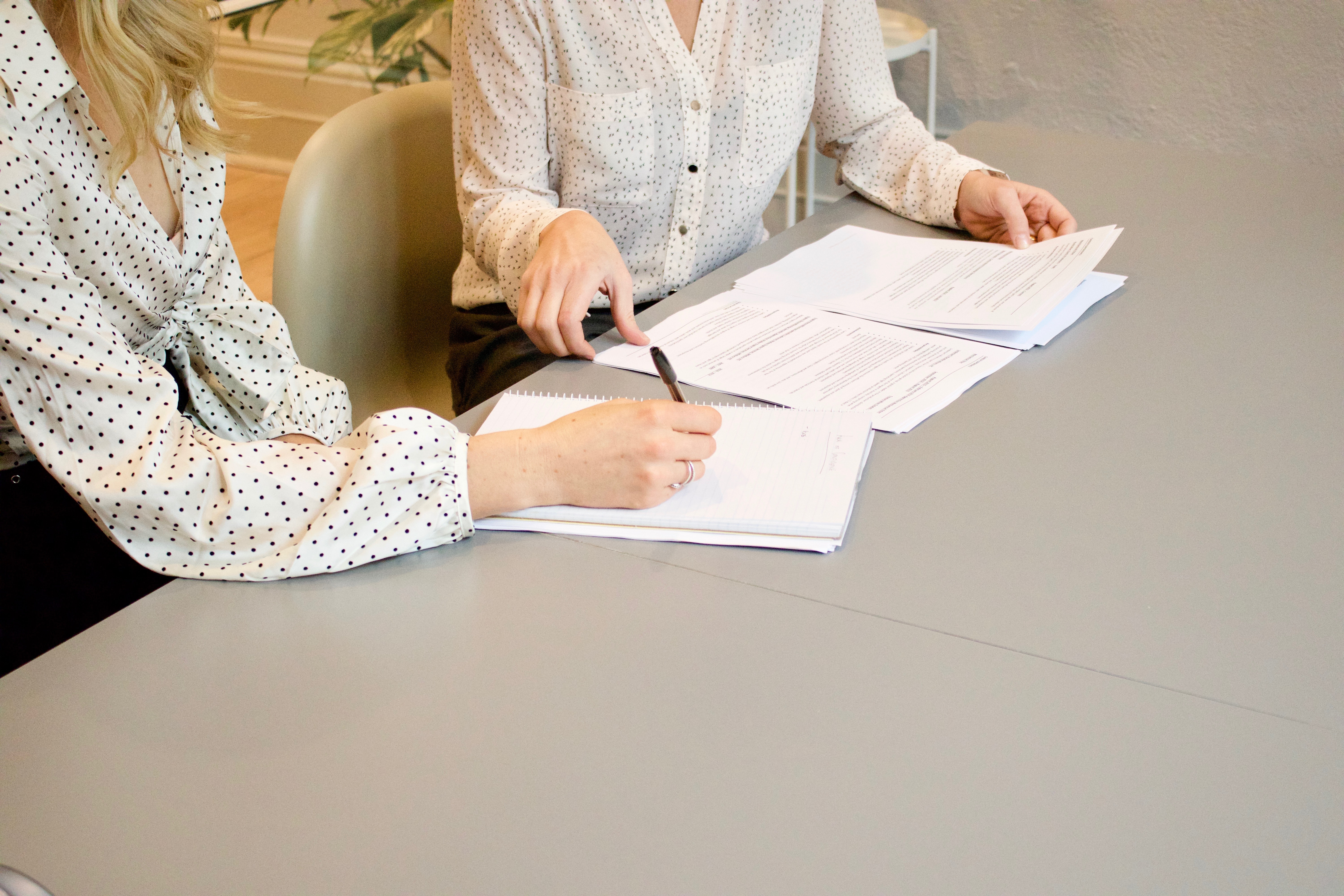 two professional women collaborating in an office setting